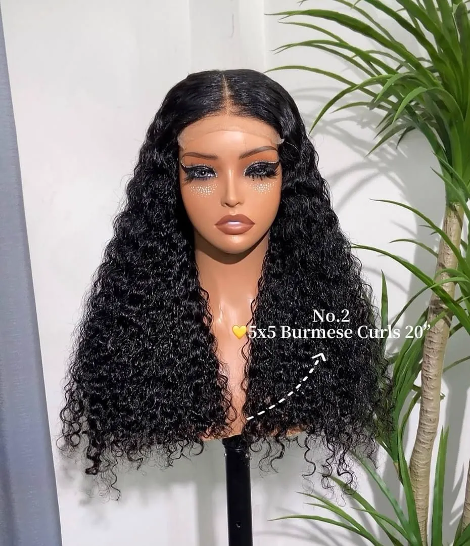 Vietnamese hair wig with defined curls on a display head
